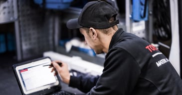 a toyota technician working with our T-Stream software