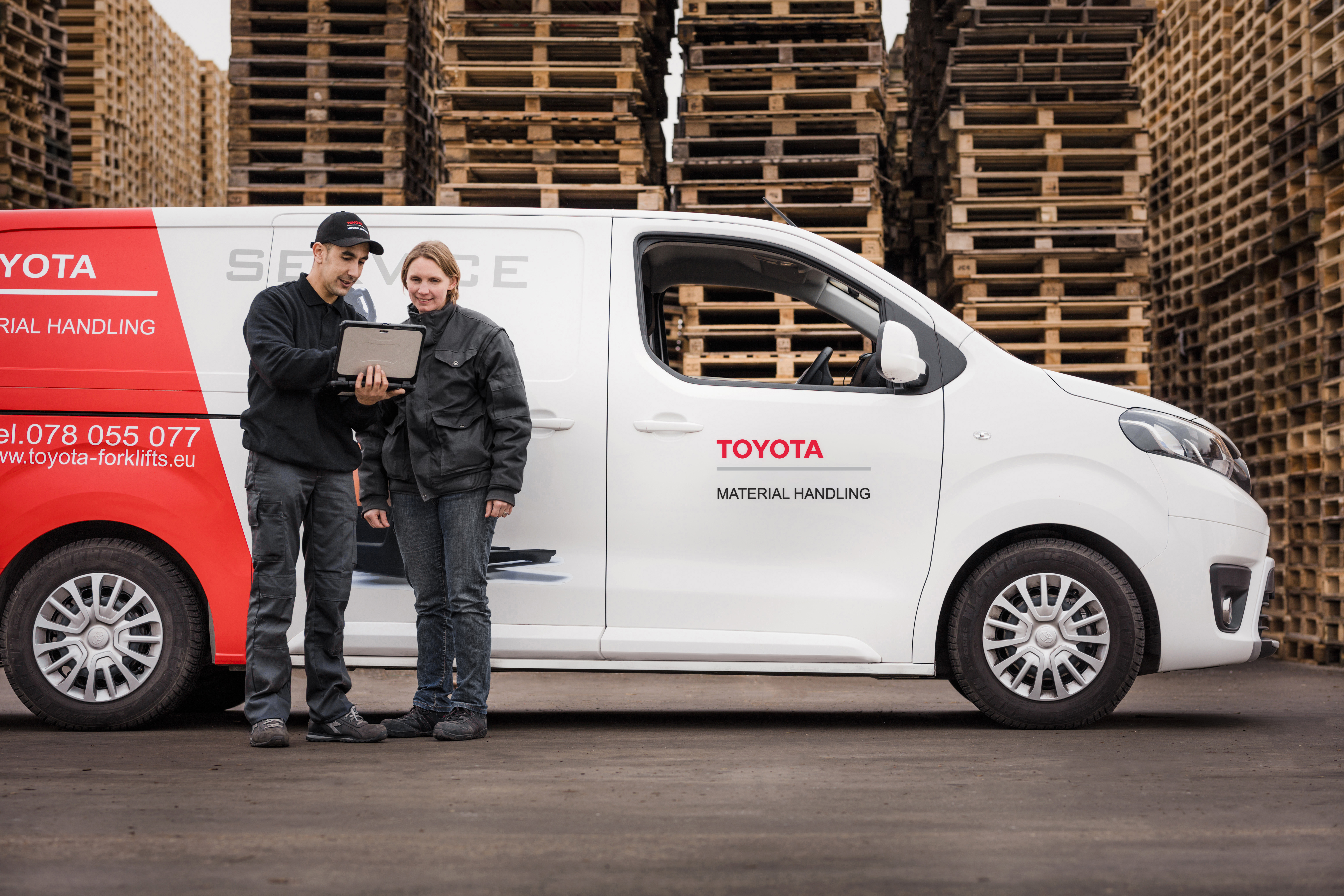 Toyota service technician with van